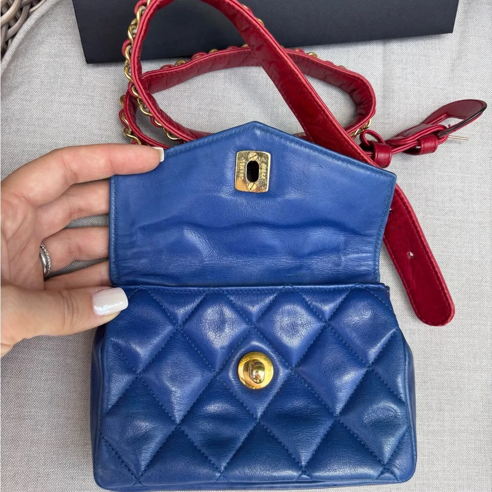 CHANEL Blue Quilted Mini Bag with Red Strap